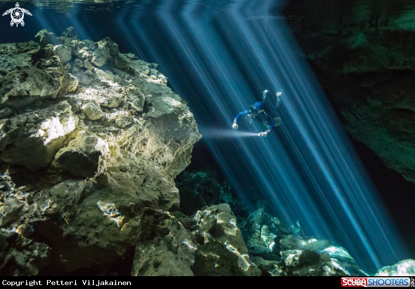 A Diver inside light beams